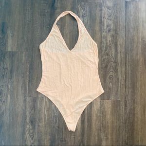 Me to We cream colored bodysuit